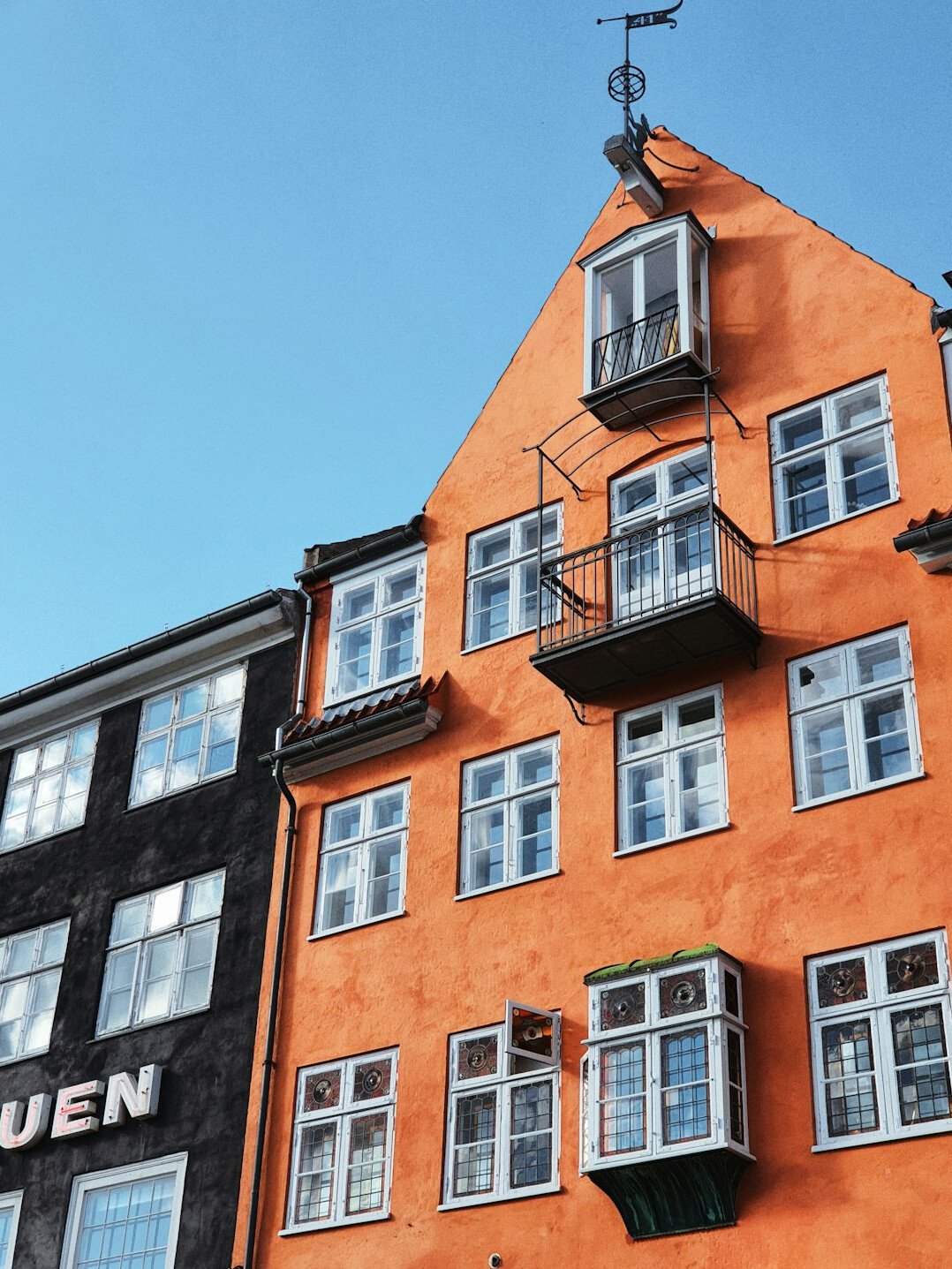 Colorful narrow street with old townhouses in a Danish town