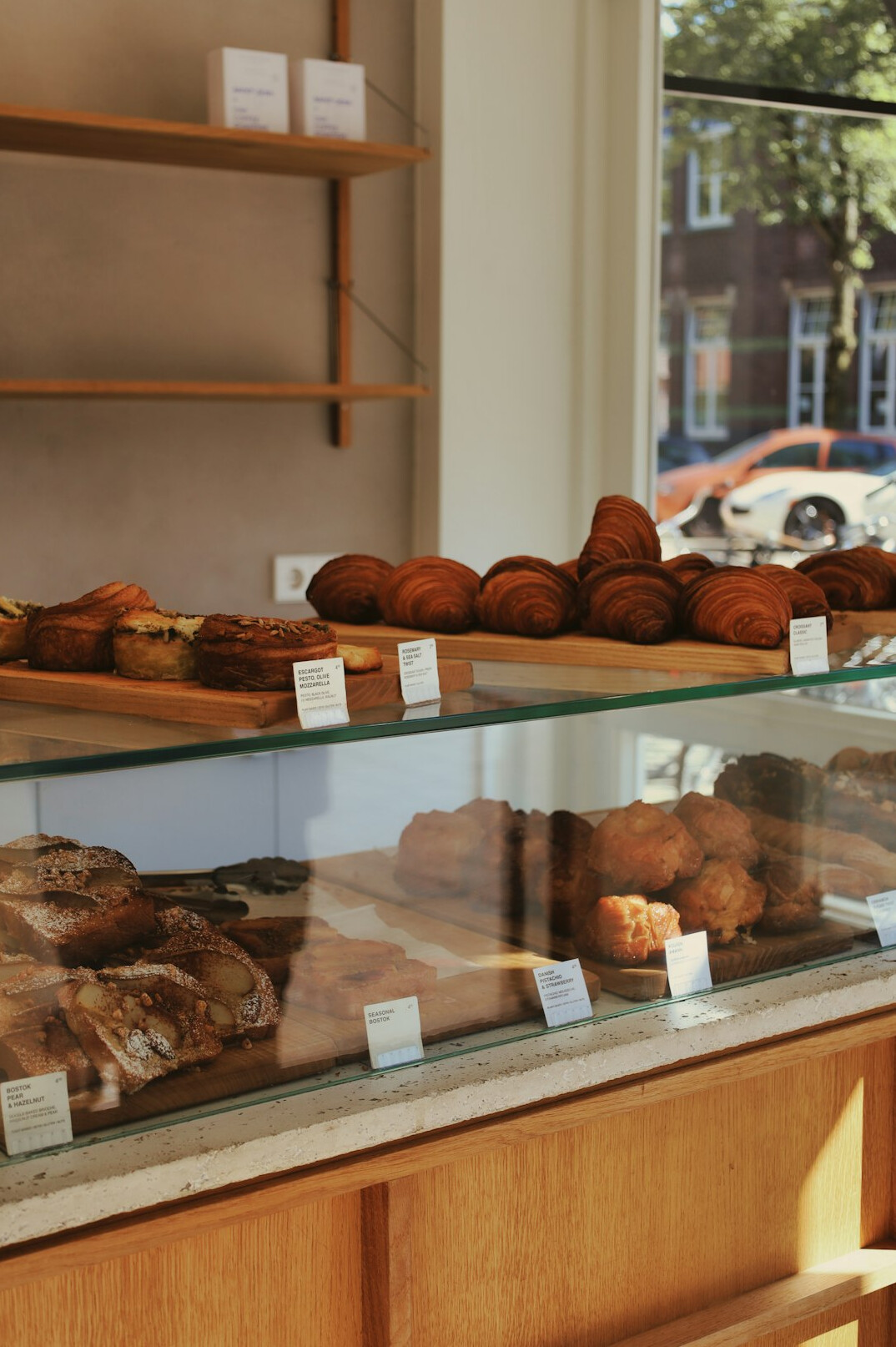 Fresh pastries and bread displayed in a bakery window